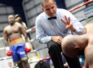 Referee Luis Pabon counts after Wayman Carter hit the canvas for the first time in Saturday's second round. (Photo by Max Schanfarber)