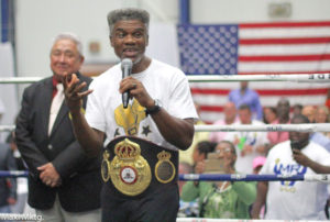 Three-time world boxing champion Julian 'The Hawk' Jackson receives a replica of his first world title belt at Saturday's boxing event. (Photo by Max Schanfarber)