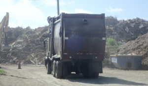 A trash truck hauls waste to the landfill on St. Croix. (File photo)