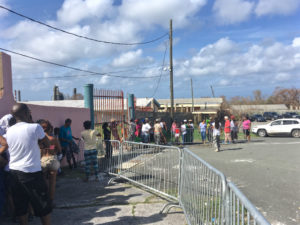 St. Croix residents wait for food and water at Juanita Gardine Elementary on Saturday. (Marina Leonard photo)