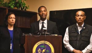 From left, Dr. Jacqueline Pender, Attorney General Claude Walker and acting Forensic Division Head Robert Soto.