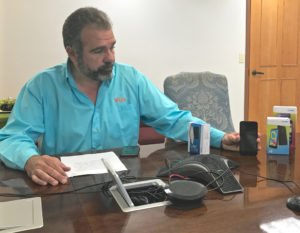 Viya CEO Alvaro Pilar demonstrates how various wireless devices work. (James Gardner photo)