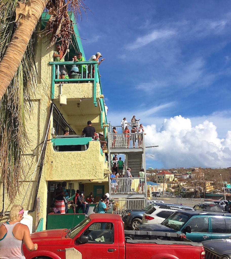Days after Irma, St. John residents cluster around the Boulon Center on Sept. 10. The center was only spot with cell service in Cruz Bay.
