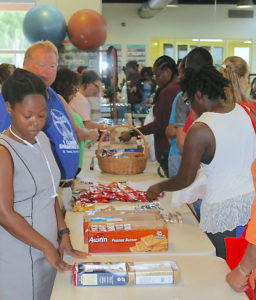 UVI employees browse supply tables set up Thursday at the Wellness Center on the university’s St. Thomas campus.