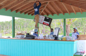 Magens Bay employees work to set up the concession stand for hungry visitors.