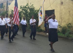 Crucian veterans march through Frederiksted Saturday in honor of Veterabs Day.