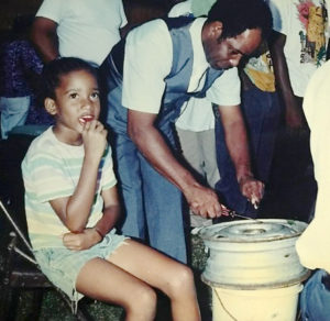 Harold Johnson Sr. plays percussion on an improvised instrument, an auto wheel. (Johnson family photo)