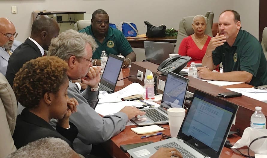 Members of the Public Service Commission discuss hurricane recover y efforts.