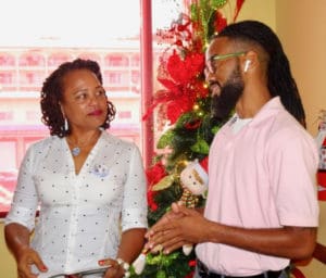 Melody Rames of the Crucian Christmas Festival and Shamari Haynes, owner of the Simpl y Sophisticated Fun Troupe, winner of the festival's Adult Parade.