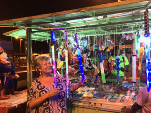 Roberta Leonard looks at retail items at booth. (Marina Leonard photo)