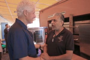 In February 2018, Former President Bill Clinton meets with community members, including India Association president Pash Daswani, to talk about hurricane recovery issues.