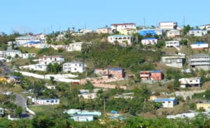 Blue tarps covering damaged roofs dot the landscape of Estate Tutu on St. Thomas in March 2018. (Bill Kossler photo) 