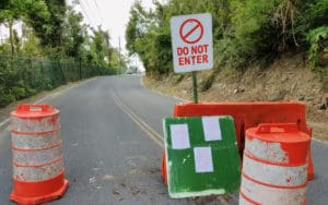 A makeshift barricade of a sign and traffic cones blocks te entrance to Magens Bay. (sap photo)