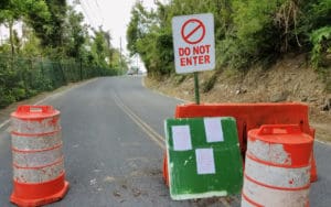 A makeshift barricade of a sign and traffic cones blocks te entrance to Magens Bay. (sap photo)