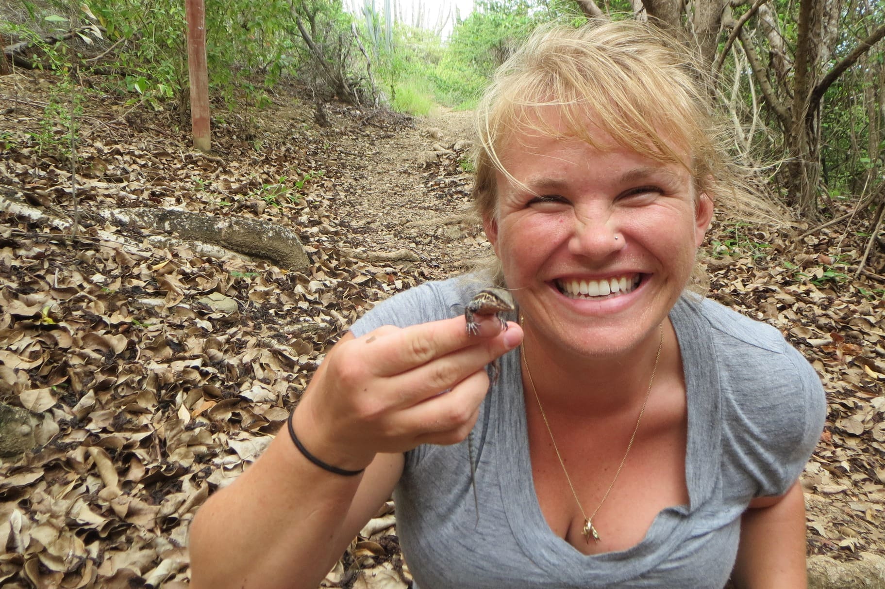 Nicole Angeli shows off a St. Croix ground lizard on Buck Island. (photo courtesy of Nicole Angeli)