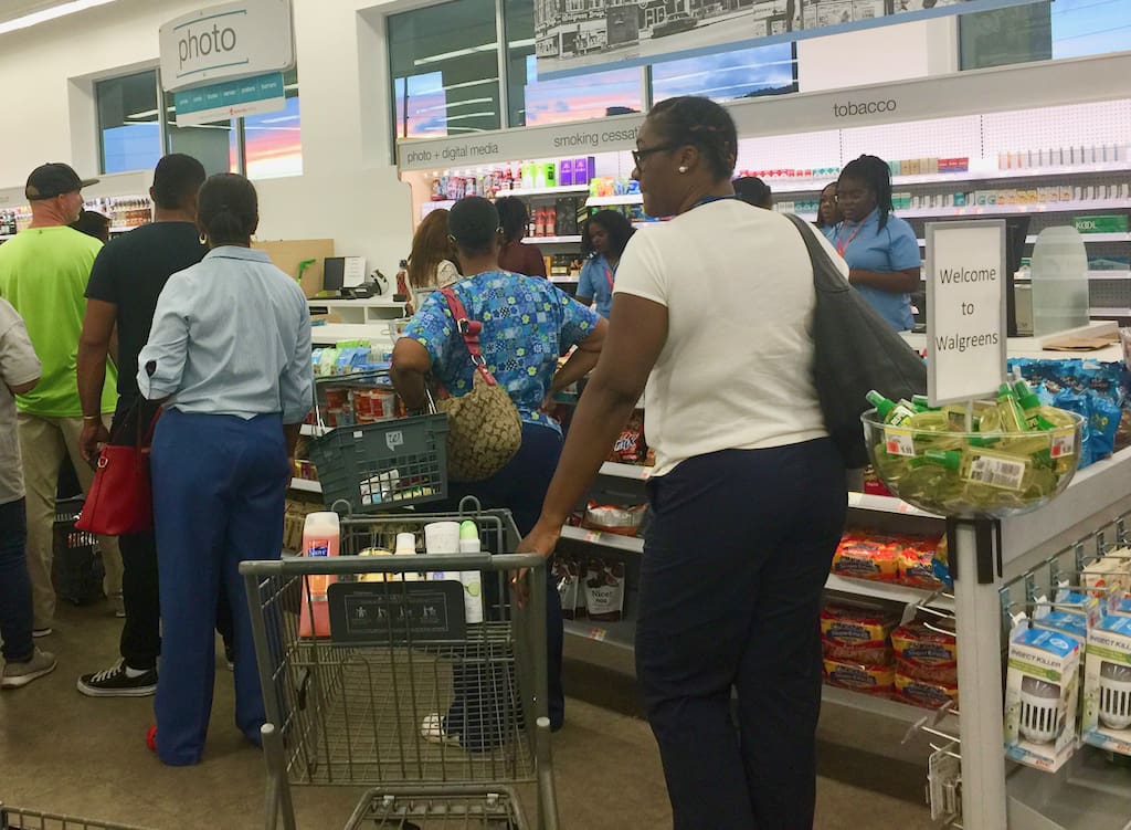 Customers line up at the checkout Monday at the re-opening of Walgreens on St. Thomas. (Kelsey Nowakowski photo)