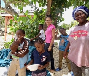 Stephanie Brinkley (right) with her grandchildren as they put up a privacy shower tent. (Anne Salafia photo)