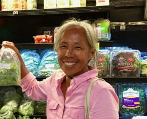 Josephine Roller holds a bag of her organic greens.