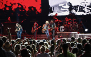 Kenny Chesney, center in white cowboy hat, and his band perform for the huge crowd in Philadelphia. (Photo by William Stelzer)