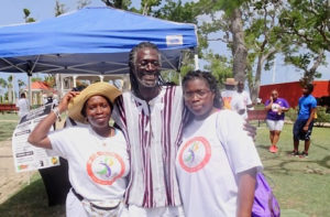 From left, Vivian St. Juste, Positive Nelson and Doris St. Juste relax in Frederiksted after the Freedom Walk.