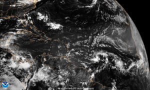 The GOES-East satellite photo shows Hurricane Beryl toward the lower right. This image is provided by the National Environmental Satellite, Data, and Information Service.
