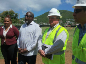From left, Insular Superintendent Dionne Wells Hedrington, Education Department Chief of Staff Anthony Thomas and Aecom Project Director Pat Mitchell meet reporters to discuss progress on installing modular classrooms across the territory.