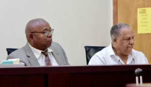 PSC Executive Director Donald Cole, left, and Commissioner Kent Bernier listen to the testimony at Tuesday's PSC meeting. (April Knight photo)