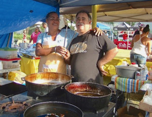 Ana Quinones and Jaime Felix cook pates, alcapurria, fried chicken and bacalaitos at the 2014 VIPR Friendship Fiesta. (File photo)