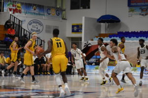 Kyle Clarke, No. 11, dribbles the ball upcourt for Kennesaw State in its opening round loss to Missouri. Clarke represented the Virgin Islands during summer's CAC Games and finished Friday with 10 points. 