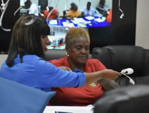 Deputy Elections Superviser Kevermay Douglas and Elections Board member Lydia Hendricks begin the count Tuesday.