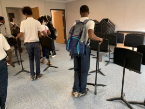 Band students set up their new practice room as school gets underway on the Arthur Richards campus Monday.. (Anne Salafia photo)