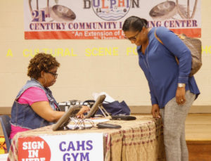 A Joseph Sibilly poll worker answers a questions from a lone voter.