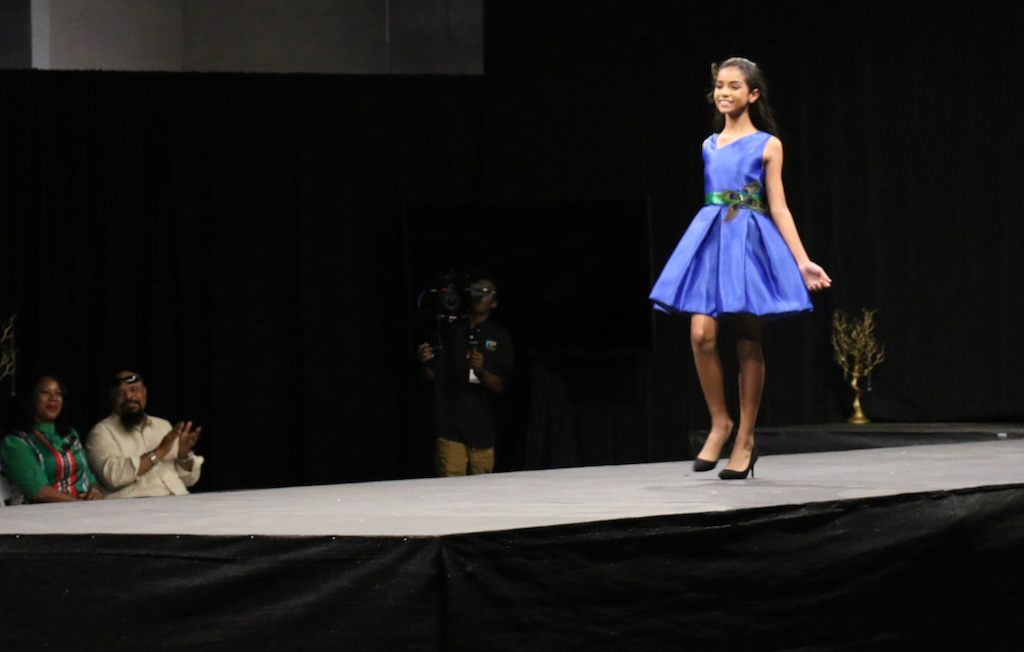 During High Fashion Competition, Alanys Medina, aged 11 of St. Croix, comes down the runway to applause. (Linda Morland photo) 