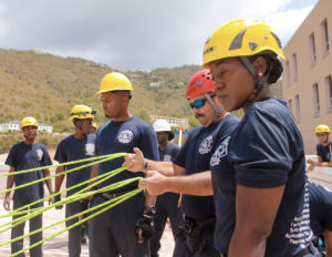 V.I. Firefighter Camilla Myer, right, and her colleagues learn how to anchor ropes securely along at Thursday’s training.