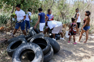 A dozen or more Crucians gather to collect trash on St. Croix this spring. (File photo by Linda Morland)