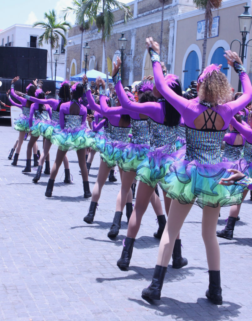The Caribbean Ritual Dancers brought almost 50 performers in rainbow tutus and purple leotards to bring the crowd to to their feet. (Bethaney Lee photo)