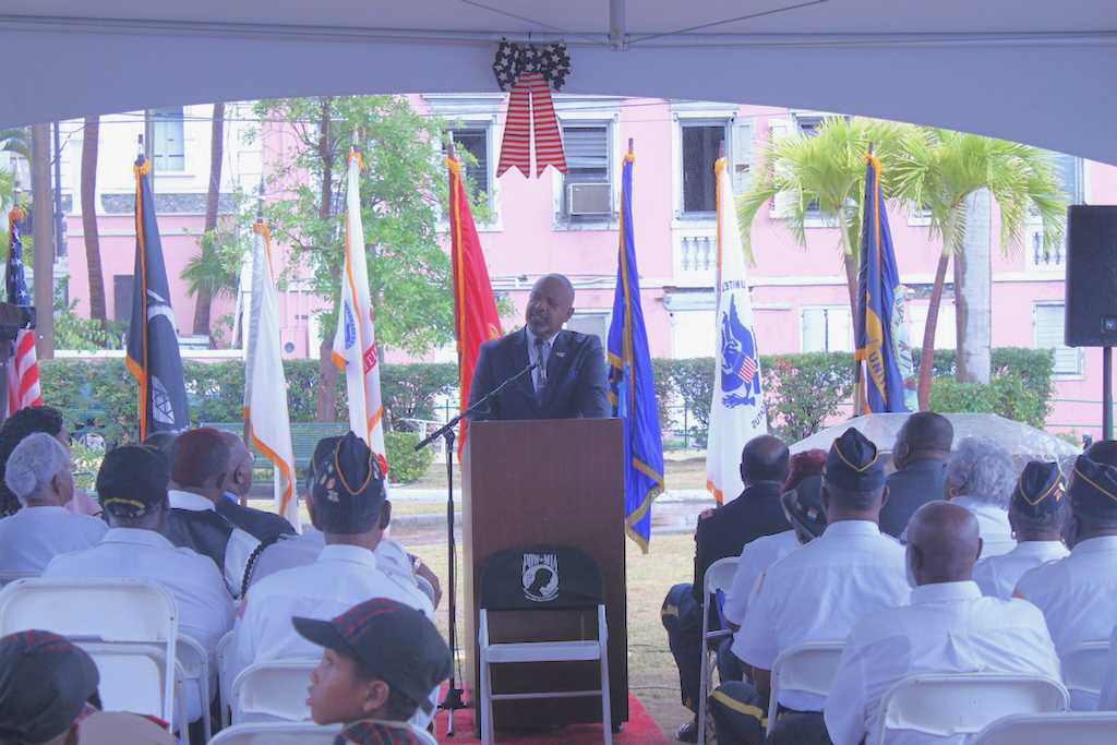 V.I. Lt. Gov. Tregenza Roach speaks to an audience of nearly 75 onlookers who have come to observe Memorial Day. 