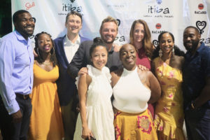 At the April 29 relaunch event, from top row, left: Jed Hope Carter, Raven Carter, partner Benjamin Ireland, partner Michael DelGiacco, Ellie DelGiacco, Africa Miranda, Andre Erysthee; front row from left, partner Phuong Ireland and Yoki Hanley. (Photo by George Armstrong)