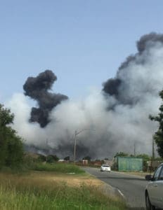 Smoke billows on Sunday afternoon from a fire at the Anguilla Landfill, adjacent to the Henry E. Rohlsen Airport on St. Croix. (Source photo by Susan Ellis)