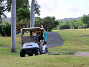 Enjoying the afternoon, golfers take a short ride to the next hole. (Linda Morland photo)