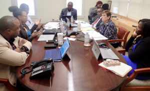 Discussing disaster recovery at the PFA board meeting are Kirk Callwood, Jenifer O’Neal, Keith O’Neale, Gov. Albert Bryan, Nathan Simmonds, Dorothy Isaac and Adrienne Williams-Ocatalien.