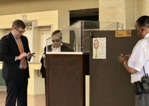 Former Casino Control Commission Chairwoman Violet Anne Golden and her attorney, David Cattie, prepare to leave the Ron deLugo Federal Courthouse Wednesday after an arraignment hearing. (Source photo by Judi Shimel)