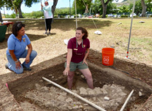 Archaeological technician Amelia Jansen of the National Park Service Southeast Archaeological Center talks about the excavation of what might have been a utilitarian area for holding water, perhaps for watering livestock or washing clothes. As the NPS is able to receive grants, the progress of unearthing this part of Crucian history will continue. (Source photo by Linda Morland)