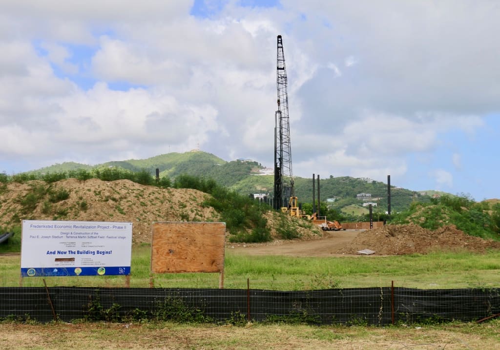 The sign at the Joseph Stadium site proclaims 'And Now the Building Begins,' but that was two years ago and little has work has been seen on the site. (Source photo by Linda Morland)