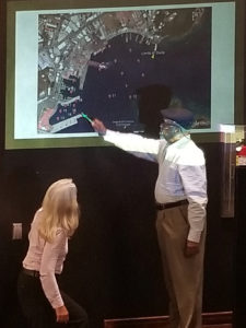 CZM Chairman Winston Adams points to various sites on the map while Amy Dempsey of Bioimpact Inc. explains the studies. (Source photo by Bethaney Lee)