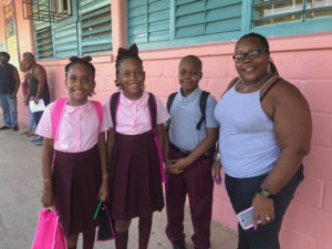Empress, Princess & Eyan with mother Letitia Henry are ready to get back to school. (Source photo by Elisa McKay)