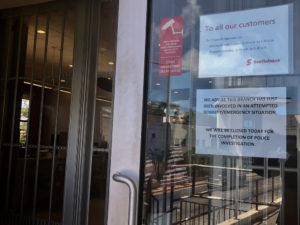 Sign on the Scotia Bank door says the branch is closed while police investigate attempted robbery. (Source photo by Judi Shimel)