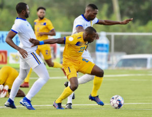 Rashad Jules of Barbados fights off two USVI defenders en route to scoring the only goal in Saturday's CONCACAF match. (CONCACAF photo)