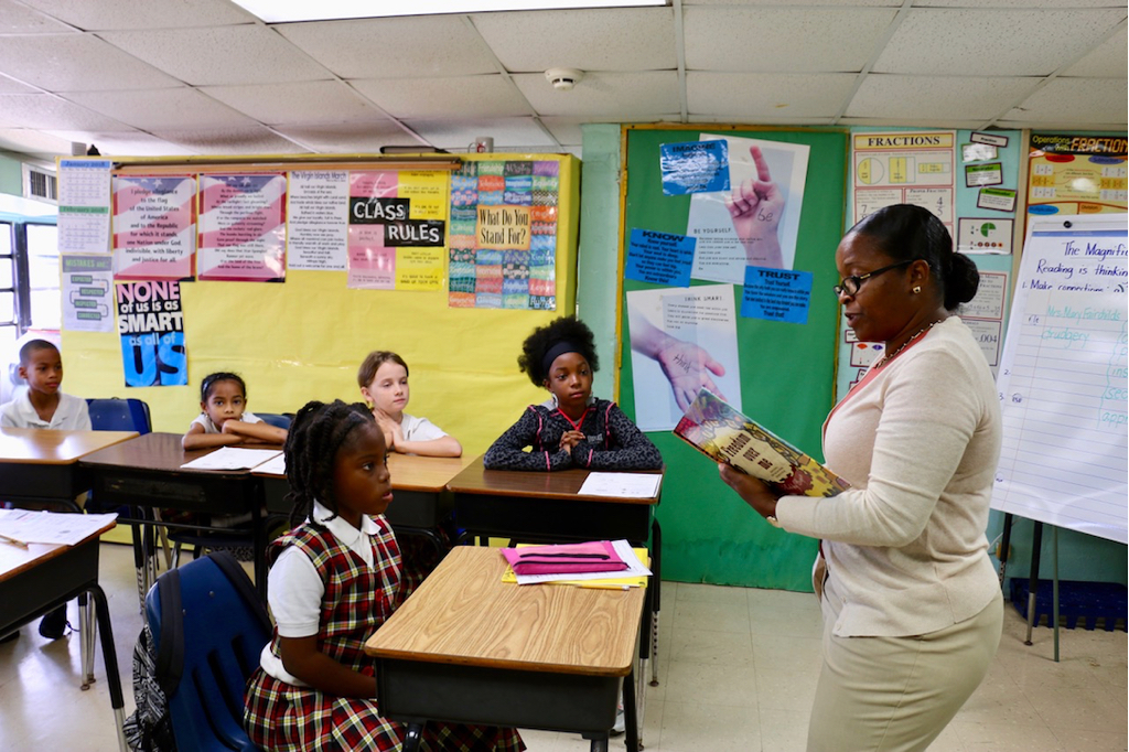 Zarah O’Reilly-Bates reads to her class in 2018. (Source photo by Linda Morland)