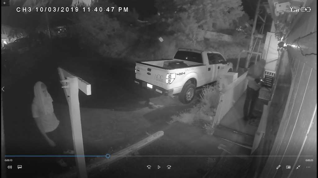 Image from the security camera at the Animal Care Center shows two men breaking into a nearby car rental company on Oct. 3.